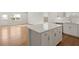 Spacious kitchen with a large island, white cabinets, and modern finishes at 488 Village Ln, Fairburn, GA 30213