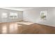 Bright living room with hardwood floors, natural light, and white walls at 488 Village Ln, Fairburn, GA 30213