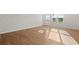 Hardwood flooring and natural light fill the open living space at 488 Village Ln, Fairburn, GA 30213