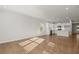 Open-concept living area featuring hardwood floors and lots of natural light at 488 Village Ln, Fairburn, GA 30213
