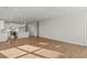 Open floor plan connecting the living room and kitchen with hardwood floors at 488 Village Ln, Fairburn, GA 30213