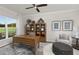 Inviting home office with a large desk, stylish furnishings, and ample natural light at 488 Village Ln, Fairburn, GA 30213