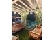Atmospheric backyard swing set with subtle lighting and decorative vines, creating a peaceful nighttime ambiance at 3809 Autumn View Lane Nw Ln, Acworth, GA 30101