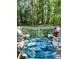 Inviting back deck with comfortable seating, lush greenery, and privacy at 3809 Autumn View Nw Ln, Acworth, GA 30101