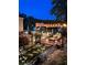 Backyard patio with string lights and landscaping and outdoor seating at 3809 Autumn View Nw Ln, Acworth, GA 30101