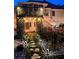 Backyard with a covered patio, lush greenery, and stone pathway at 3809 Autumn View Nw Ln, Acworth, GA 30101