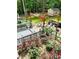Spacious backyard with deck, pergola, seating, and floral landscaping at 3809 Autumn View Nw Ln, Acworth, GA 30101
