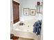 Inviting bathroom features a soaking tub, window, and lovely decor for ultimate relaxation at 3809 Autumn View Nw Ln, Acworth, GA 30101