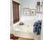 Relaxing bathroom with a soaking tub, natural light, and elegant fixtures at 3809 Autumn View Nw Ln, Acworth, GA 30101