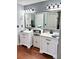Modern bathroom with double sinks, large mirror, and contemporary fixtures at 3809 Autumn View Nw Ln, Acworth, GA 30101