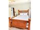 Comfortable bedroom showcasing a unique wooden bed frame with neutral decor at 3809 Autumn View Nw Ln, Acworth, GA 30101