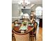 Formal dining room featuring hardwood floors, an elegant chandelier, and a beautifully set table at 3809 Autumn View Nw Ln, Acworth, GA 30101