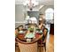This spacious dining room features hardwood floors, a decorative chandelier, and lots of natural light at 3809 Autumn View Nw Ln, Acworth, GA 30101