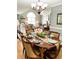 Elegant dining room with hardwood floors, decorative chandelier, and a view to the living area at 3809 Autumn View Nw Ln, Acworth, GA 30101