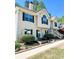 Two-story home features a well-manicured lawn, lush landscaping and a patio with seating at 3809 Autumn View Nw Ln, Acworth, GA 30101