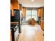 Well-lit kitchen with modern appliances, oak cabinets, and sleek countertops for ample workspace at 3809 Autumn View Nw Ln, Acworth, GA 30101