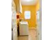 Bright and functional laundry room featuring a washer, dryer, built-in shelves, and convenient storage space at 3809 Autumn View Nw Ln, Acworth, GA 30101