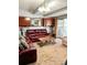 Spacious living room with plush carpeting, red couches, and a glass coffee table at 3809 Autumn View Nw Ln, Acworth, GA 30101