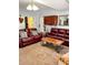 Cozy living room featuring comfortable seating, a stylish coffee table, carpet flooring, and bright lighting at 3809 Autumn View Nw Ln, Acworth, GA 30101