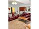Spacious living room with leather sofas, wood-trimmed coffee table, and open access to other living spaces at 3809 Autumn View Nw Ln, Acworth, GA 30101