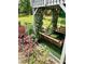Inviting backyard swing adorned with flowers and lush greenery for a tranquil escape at 3809 Autumn View Nw Ln, Acworth, GA 30101