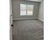 Cozy bedroom with neutral carpet, base molding and a window allowing natural light at 4015 Sierra Vista Cir, Cumming, GA 30040