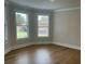 Sunlit bedroom with large windows offering a view of the outside, creating a serene and inviting space at 4015 Sierra Vista Cir, Cumming, GA 30040