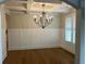 Elegant dining room featuring a coffered ceiling and a stylish black chandelier, creating a sophisticated ambiance at 4015 Sierra Vista Cir, Cumming, GA 30040