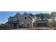 New construction featuring a two-story home with a two-car garage in a developing neighborhood at 4015 Sierra Vista Cir, Cumming, GA 30040