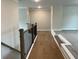 Upstairs hallway with wooden railings and hardwood flooring at 4015 Sierra Vista Cir, Cumming, GA 30040