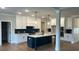 Spacious kitchen featuring white cabinets, a center island, and modern appliances, perfect for cooking at 4015 Sierra Vista Cir, Cumming, GA 30040