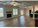 Spacious living room with a fireplace and large windows, creating a welcoming and comfortable atmosphere at 4015 Sierra Vista Cir, Cumming, GA 30040