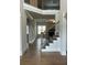Bright foyer staircase with hardwood steps and black iron railings, leading to the upper level at 4015 Sierra Vista Cir, Cumming, GA 30040
