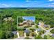 Aerial view showcases the home in a serene, wooded setting within a desirable neighborhood at 4572 Mulberry Fields Ln, Auburn, GA 30011