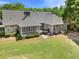 Spacious backyard features a screened porch, deck and large grassy area at 4572 Mulberry Fields Ln, Auburn, GA 30011