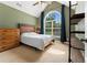 Comfortable bedroom with vaulted ceiling, abundant natural light, and a neutral color palette at 4572 Mulberry Fields Ln, Auburn, GA 30011