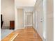 Inviting entryway featuring hardwood floors, natural light, and a view into the adjacent living spaces at 4572 Mulberry Fields Ln, Auburn, GA 30011