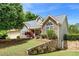 View of home showing stone and siding and the yard at 4572 Mulberry Fields Ln, Auburn, GA 30011