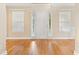 Foyer features hardwood floors, natural light, and a view of the front door at 4572 Mulberry Fields Ln, Auburn, GA 30011