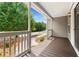 Inviting front porch with views of the lush landscaping and neighborhood street at 4572 Mulberry Fields Ln, Auburn, GA 30011
