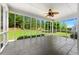 Inviting screened porch overlooking a lush backyard, perfect for outdoor relaxation and entertaining at 4572 Mulberry Fields Ln, Auburn, GA 30011