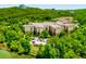 Stunning aerial view of an apartment complex surrounded by verdant trees, offering a tranquil and scenic living experience at 200 River Vista Dr # 436, Atlanta, GA 30339