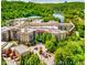 Aerial shot of an apartment complex near the river surrounded by lush trees offering a serene living environment at 200 River Vista Dr # 436, Atlanta, GA 30339