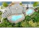 Overhead view of the community pool area with a uniquely designed pool and an abundance of lounge seating available at 200 River Vista Dr # 436, Atlanta, GA 30339
