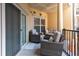 Spacious outdoor balcony with comfortable seating and views of the community at 200 River Vista Dr # 436, Atlanta, GA 30339