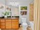 Bathroom features granite countertops, vanity storage and shower with tile surround at 200 River Vista Dr # 436, Atlanta, GA 30339