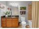 Bathroom with granite countertops and tiled shower at 200 River Vista Dr # 436, Atlanta, GA 30339