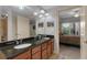 Bathroom featuring double sinks, granite countertops, and a shower at 200 River Vista Dr # 436, Atlanta, GA 30339