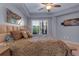 Relaxing bedroom featuring a ceiling fan, balcony access, and stylish decor at 200 River Vista Dr # 436, Atlanta, GA 30339