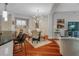 Open concept dining area with sleek lighting and hardwood floors at 200 River Vista Dr # 436, Atlanta, GA 30339